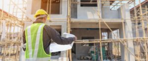 Construction worker looking at plans