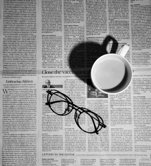 Newspaper and glasses